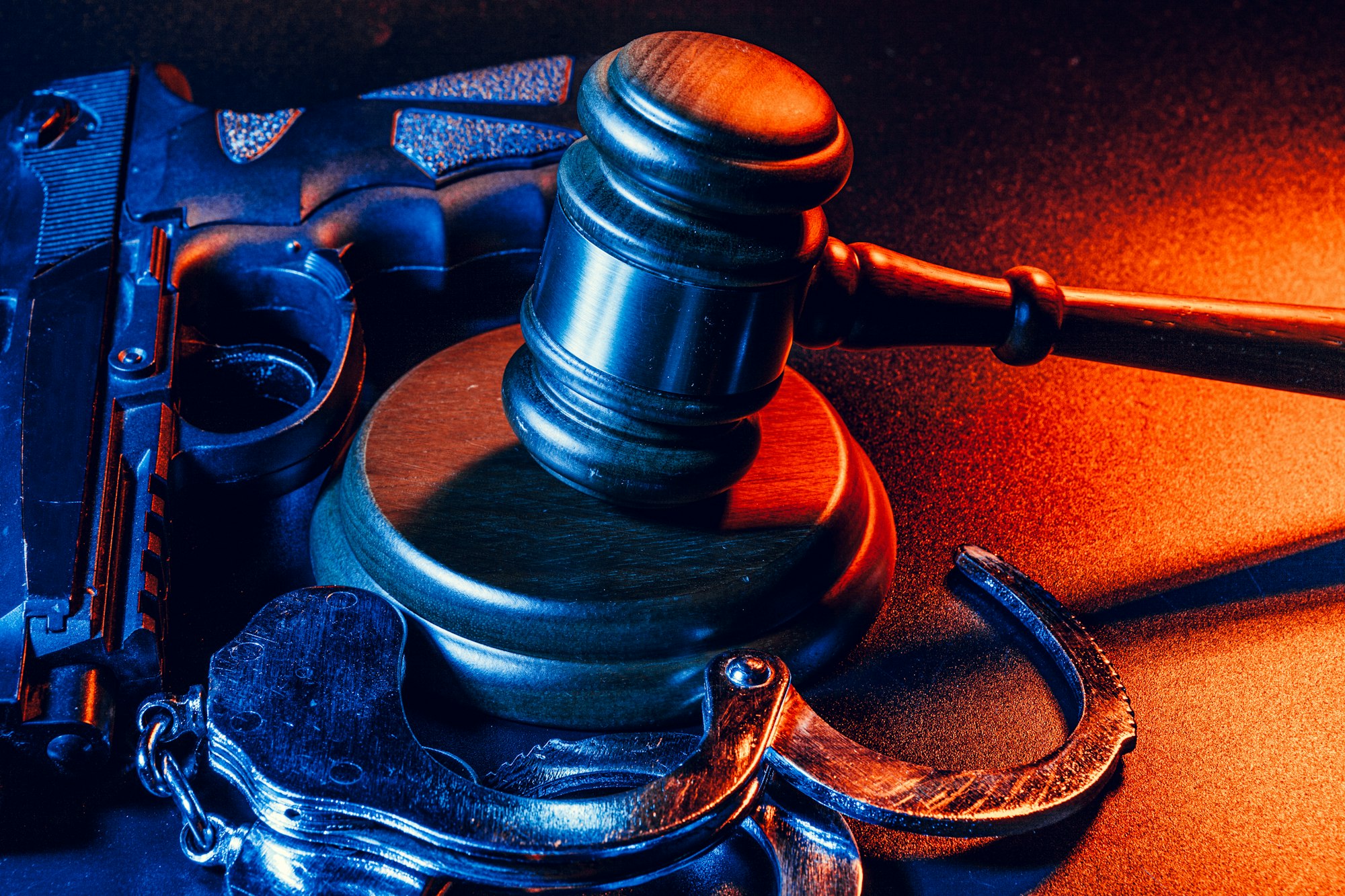 gun-and-judge-39-s-gavel-on-the-table-crime-robbery-attack-concept.jpg